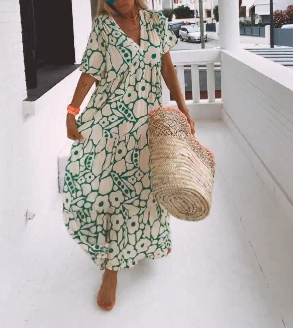 Women’s green printed short sleeve maxi dress with V neck and A-line silhouette in stretch fabric