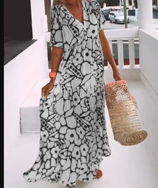 Women’s green printed short sleeve maxi dress with V neck and A-line silhouette in stretch fabric