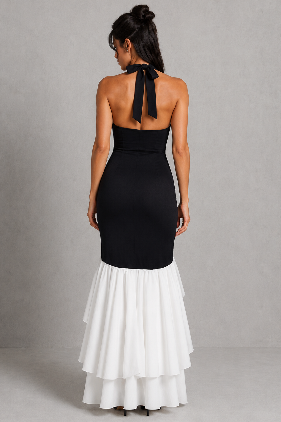 Women’s halter maxi dress featuring a plunging neckline, structured boned bodice, flowing ruffle skirt, and elegant thigh-high split, designed for evening events, formal occasions, and special celebrations.