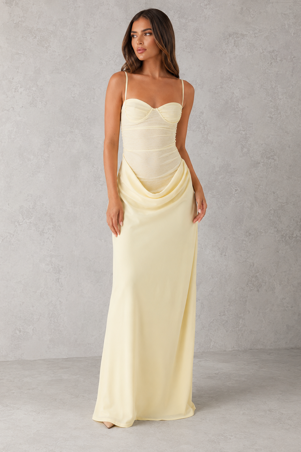 Women's lace bodice maxi dress with pleated cups, adjustable shoulder straps, draped hip detail, and a flowing skirt, designed for evening events, weddings, and formal occasions.