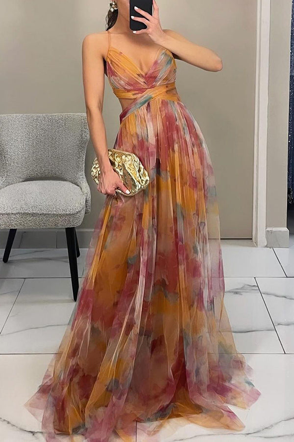 Women’s layered formal dress with flowing silhouette and soft painterly colors