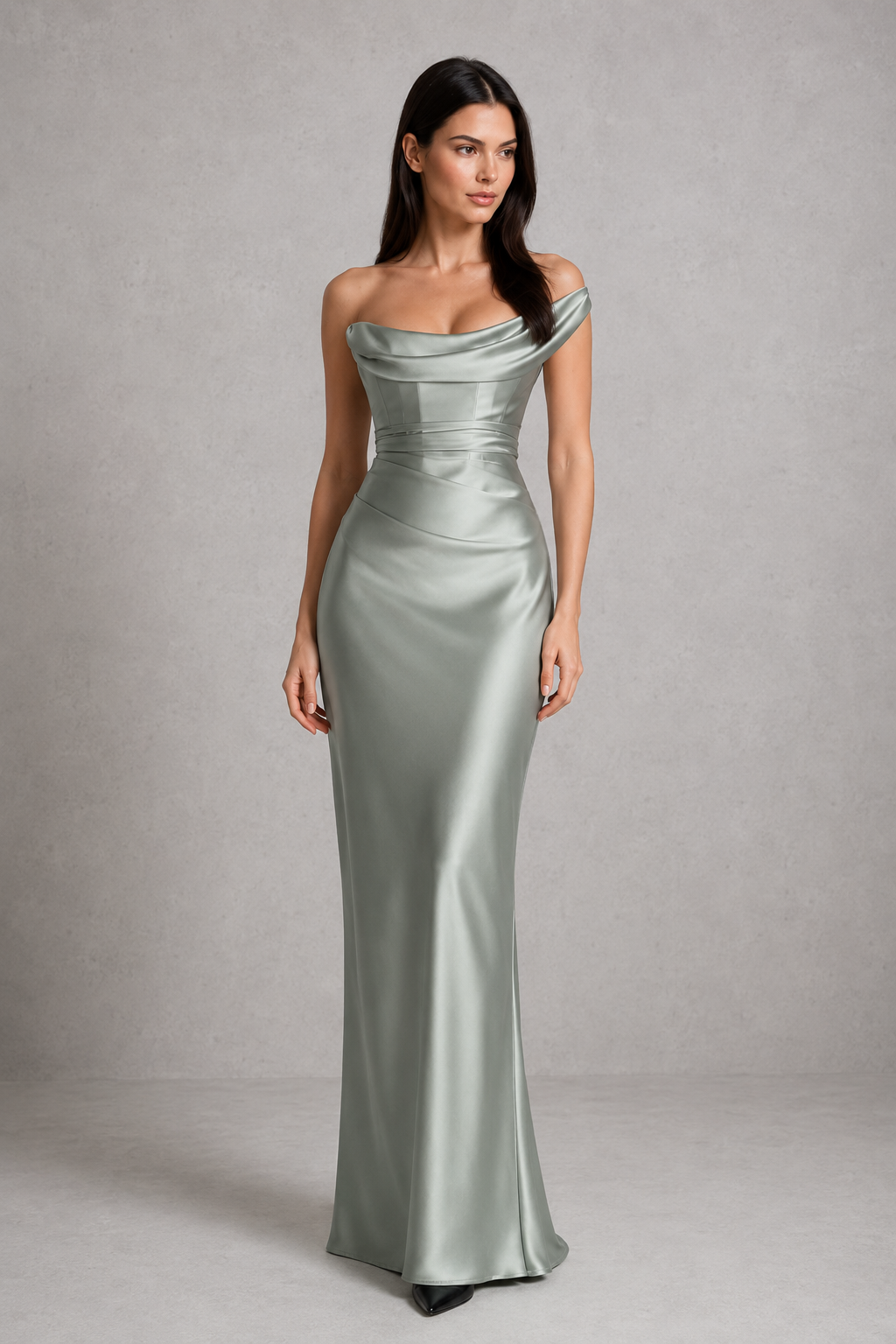 Woman wearing a one-shoulder satin maxi dress featuring a pleated cowl neckline, structured corset bodice with boning, asymmetrical draping, adjustable lace-up back, and a flowing bias-cut skirt, ideal for formal events, evening occasions, and special celebrations.