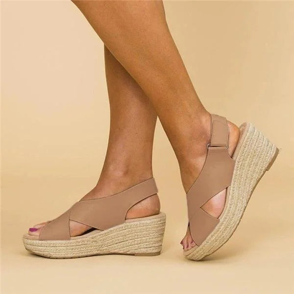 Beige sandals with platform sole on a beige background