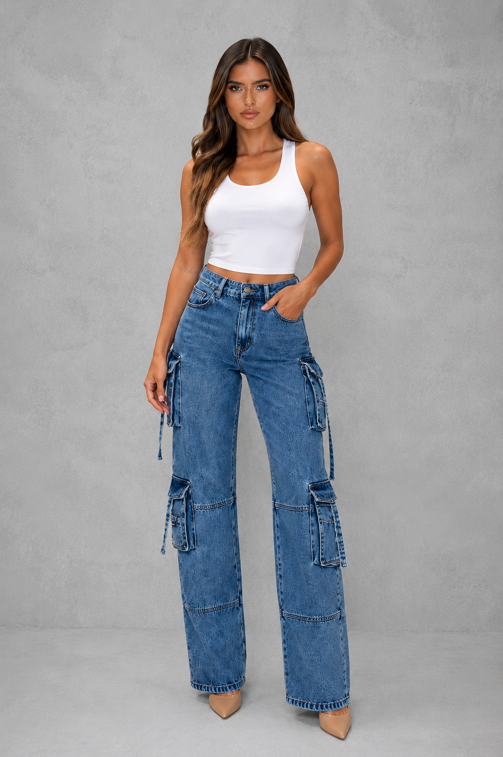 Womenโs oversized wide leg denim cargo pants with dark wash finish, distressed detailing and multiple utility pockets for casual Y2K streetwear.