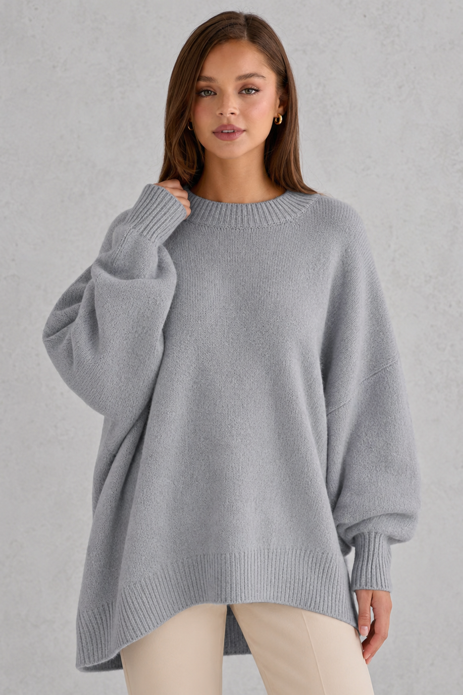 Women’s oversized wool blend sweater with asymmetrical hem, drop shoulders, and relaxed fit
