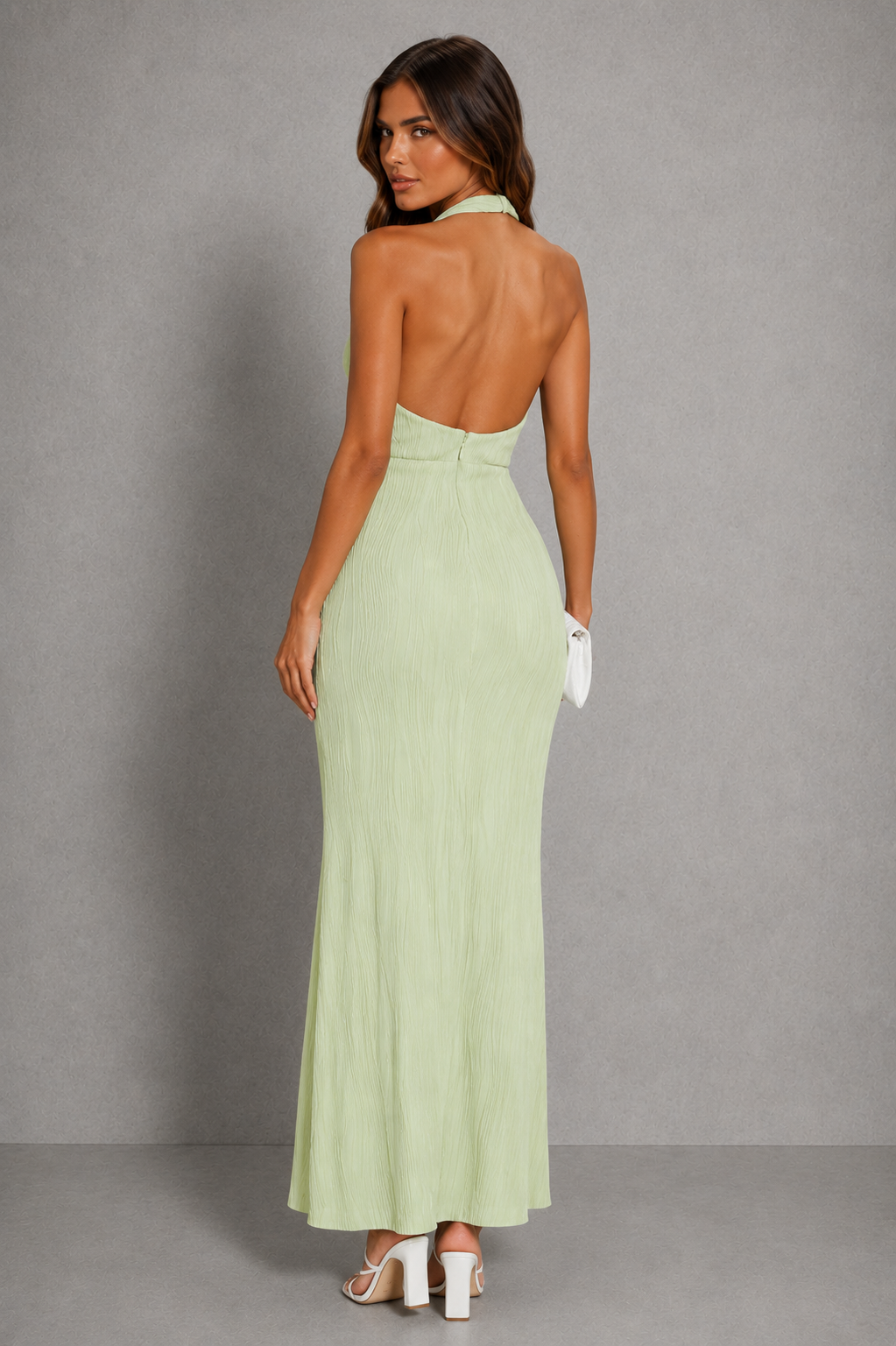 Womenโs pleated asymmetric midi dress with an elegant textured finish and flowing hemline for evening parties and special occasions.