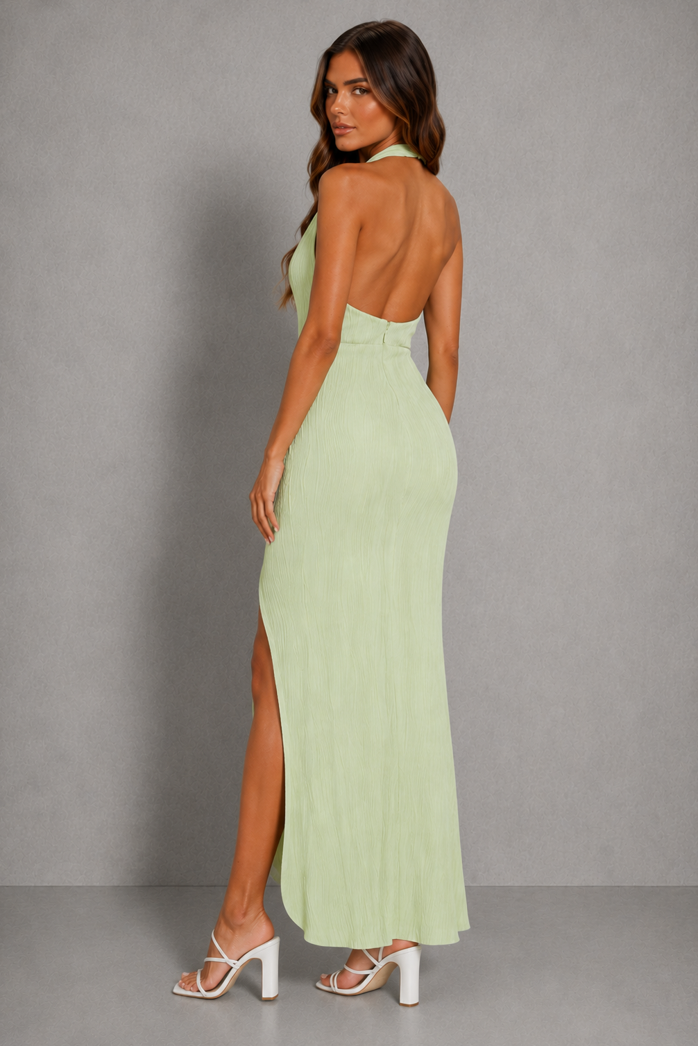 Womenโs pleated asymmetric midi dress with an elegant textured finish and flowing hemline for evening parties and special occasions.