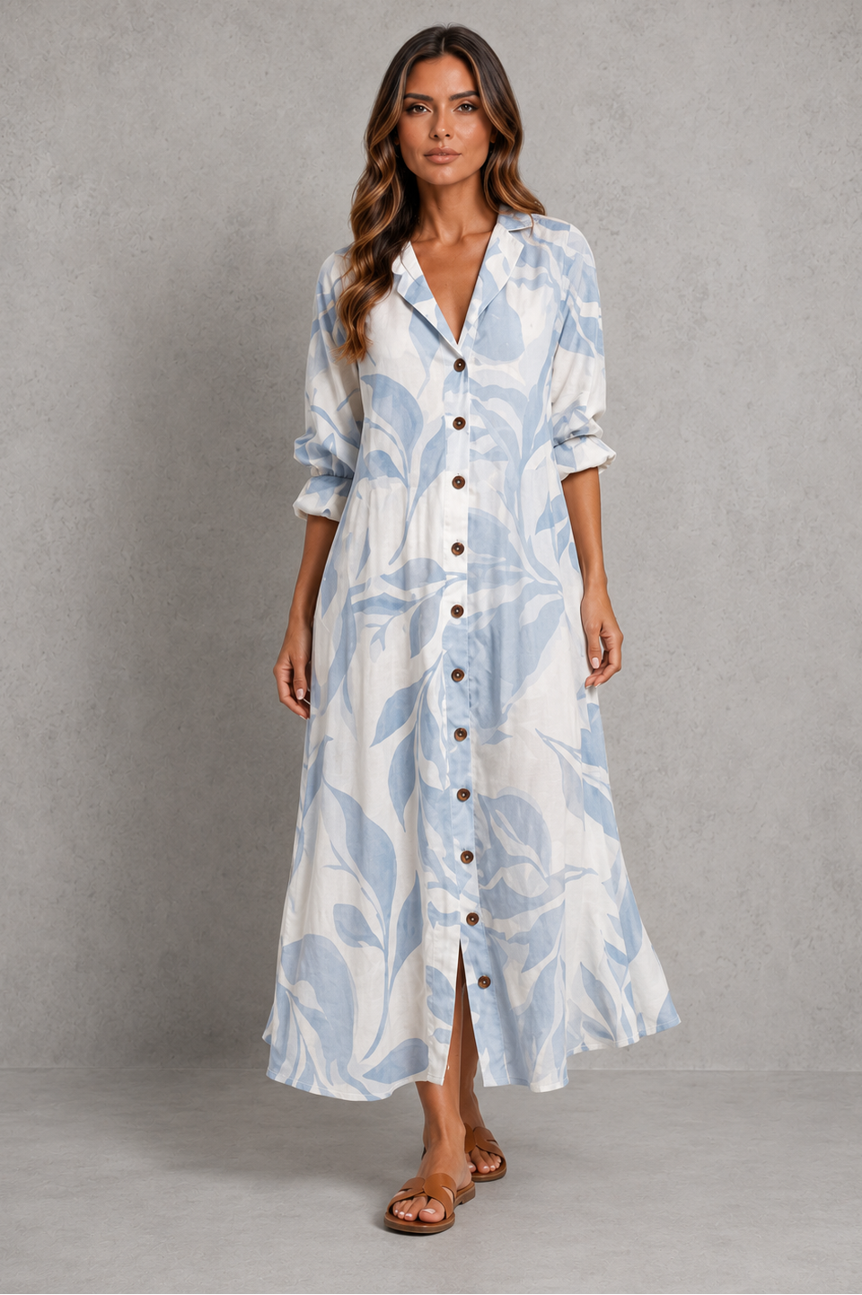 Womenโs printed shirt dress with button-front design, soft collar, relaxed flowing fit and artistic all-over print.