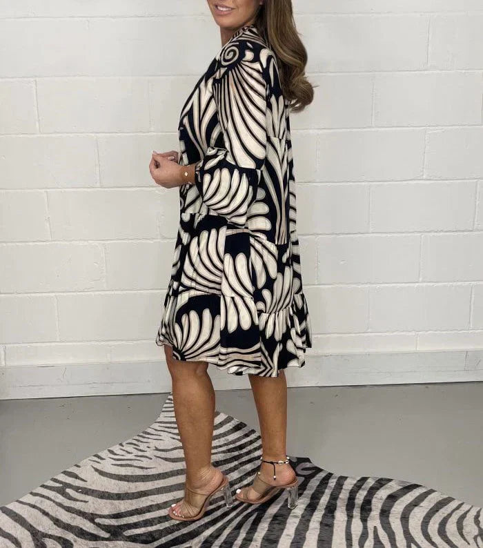Women’s printed V-neck midi dress made from lightweight polyester blend fabric