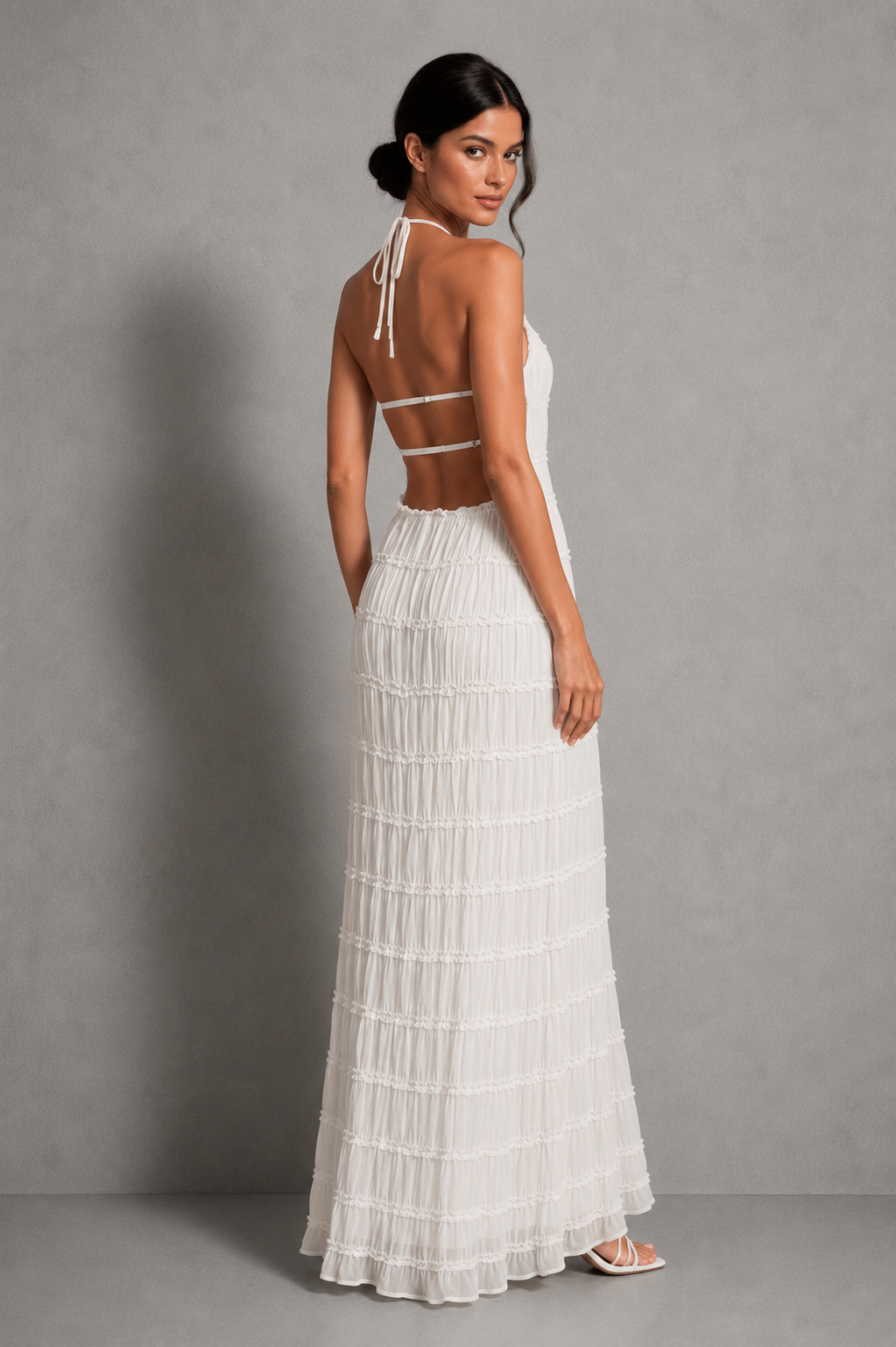 Women's ruched smocked maxi dress with a stretchy bodice, adjustable tie detail and flowing silhouette, perfect for holidays, garden parties, brunch and summer occasions.