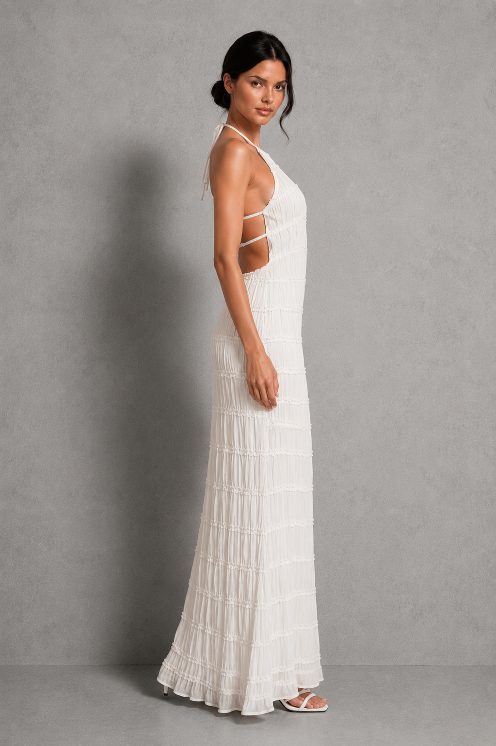 Women's ruched smocked maxi dress with a stretchy bodice, adjustable tie detail and flowing silhouette, perfect for holidays, garden parties, brunch and summer occasions.