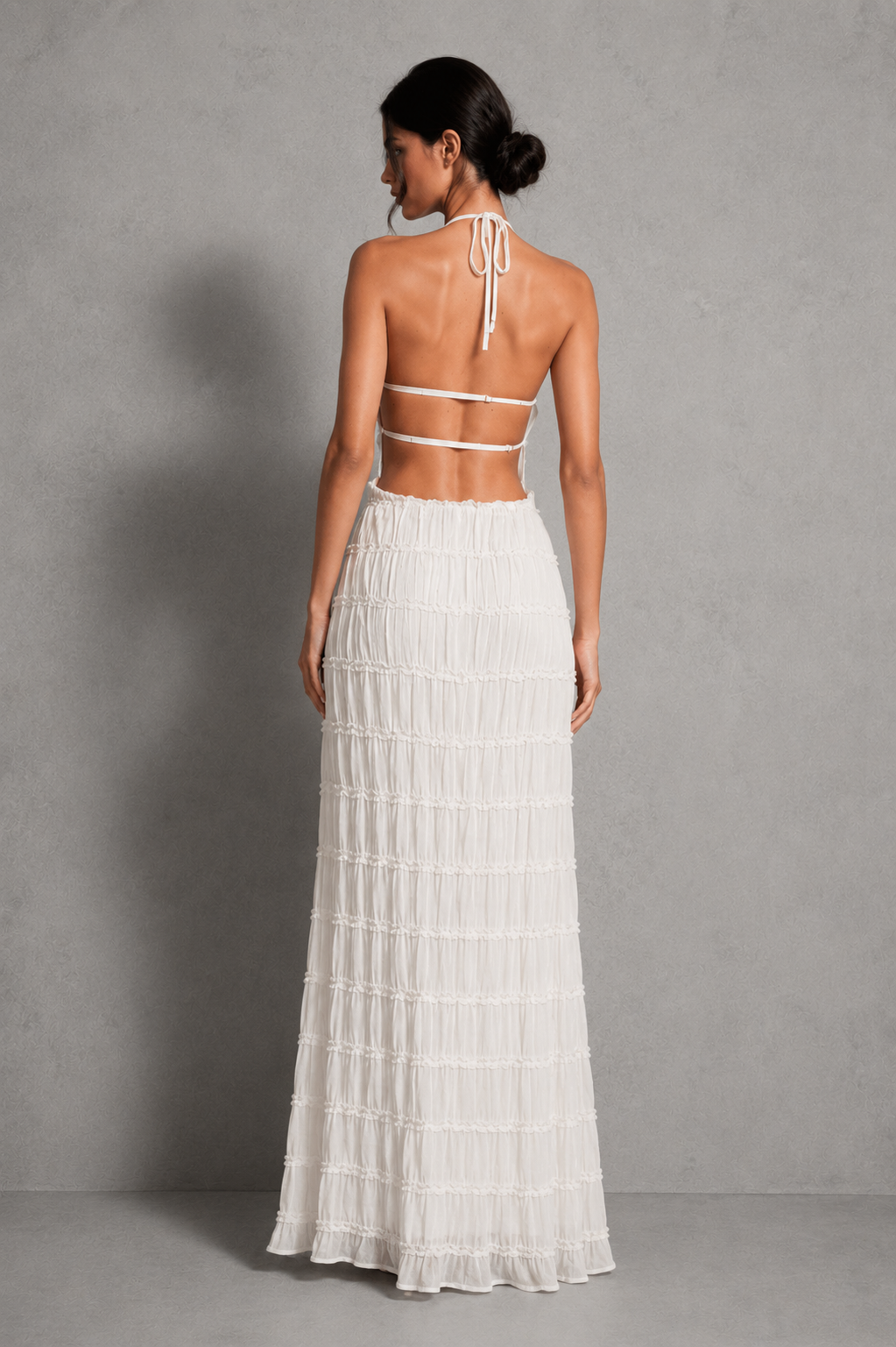 Women's ruched smocked maxi dress with a stretchy bodice, adjustable tie detail and flowing silhouette, perfect for holidays, garden parties, brunch and summer occasions.