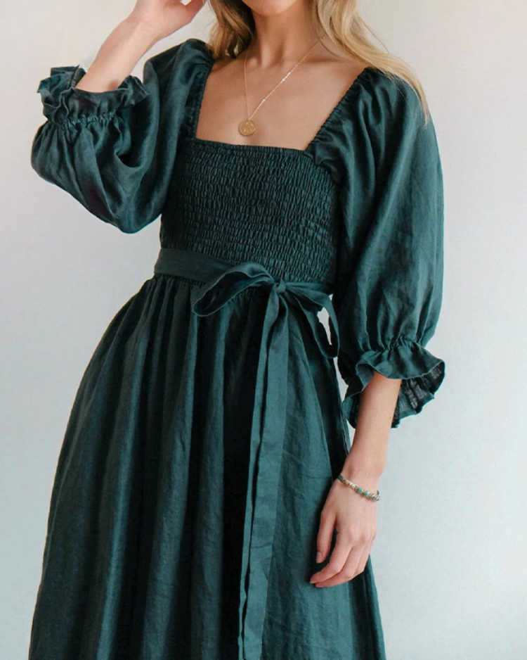 Women wearing midi dress with French ruffle sleeves and side cutout detail in slim fit silhouette