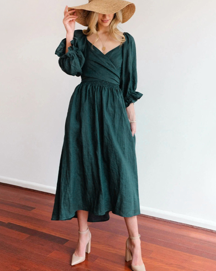 Women wearing midi dress with French ruffle sleeves and side cutout detail in slim fit silhouette