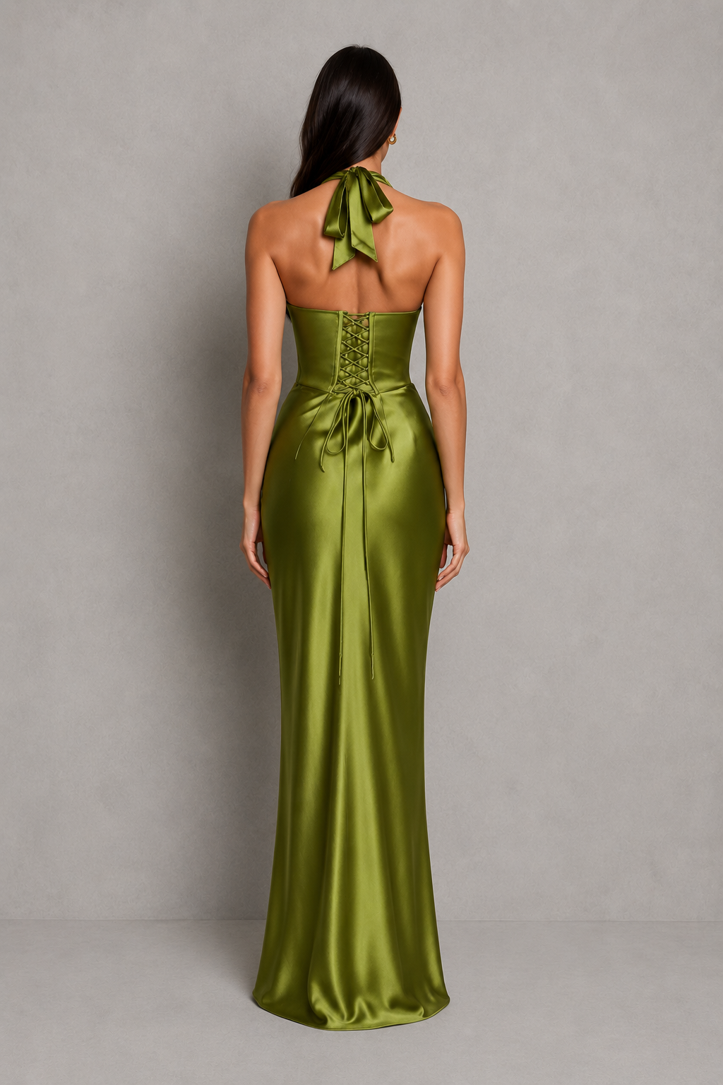 Women's satin halter maxi dress with a plunge neckline, sculptural pleated cups, asymmetric pleated bodice, and flowing bias-cut skirt. Features an internal corset bodice and adjustable lace-up back for a flattering, elegant silhouette ideal for evening events, formal occasions, and special celebrations.