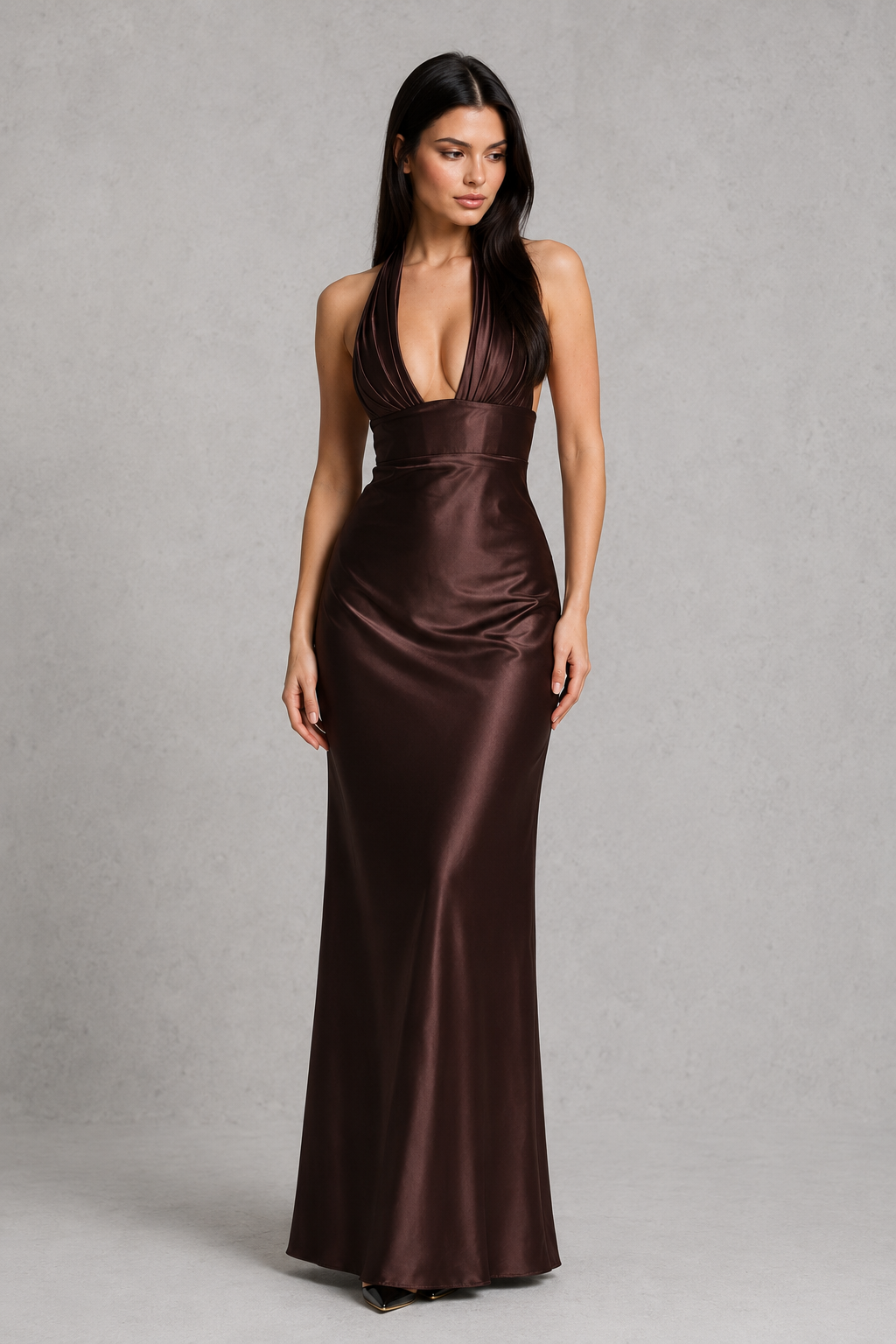 Women's satin halter maxi dress with a plunge neckline, sculptural pleated cups, asymmetric pleated bodice, and flowing bias-cut skirt. Features an internal corset bodice and adjustable lace-up back for a flattering, elegant silhouette ideal for evening events, formal occasions, and special celebrations.