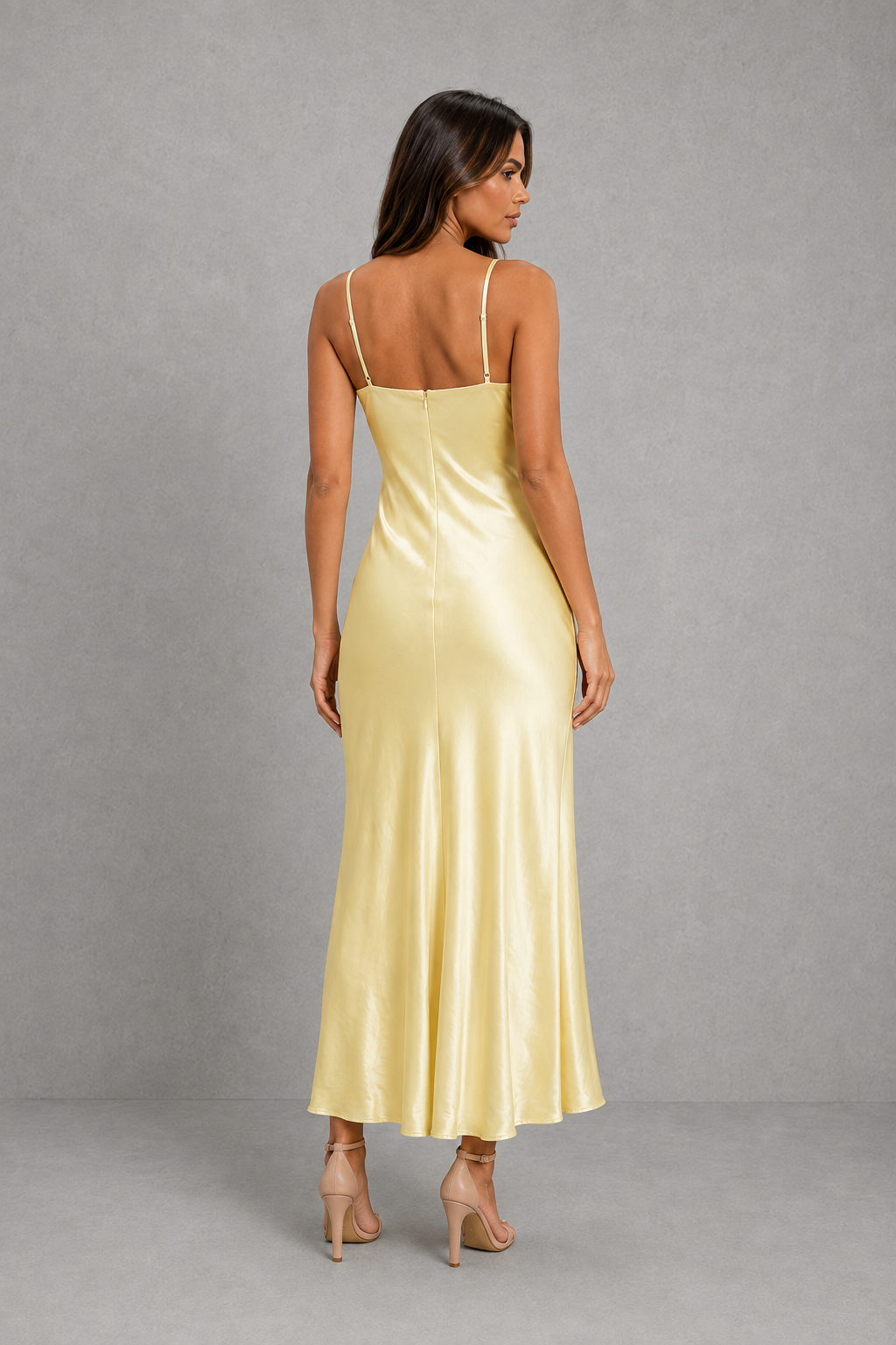 Women's elegant satin slip maxi dress with adjustable cross-back straps, a relaxed draped silhouette and a smooth satin-look finish for weddings, evenings and special occasions.