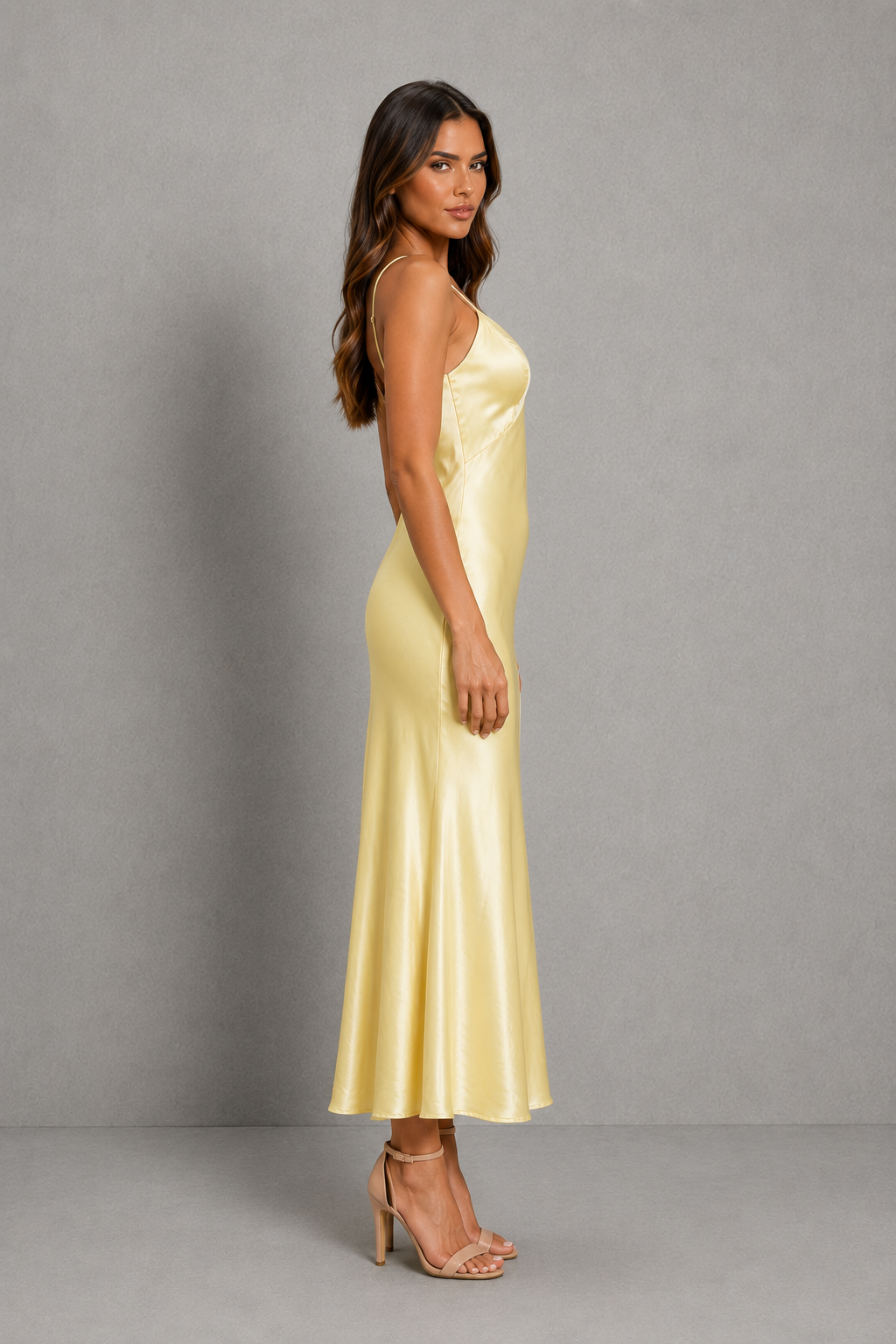 Women's elegant satin slip maxi dress with adjustable cross-back straps, a relaxed draped silhouette and a smooth satin-look finish for weddings, evenings and special occasions.