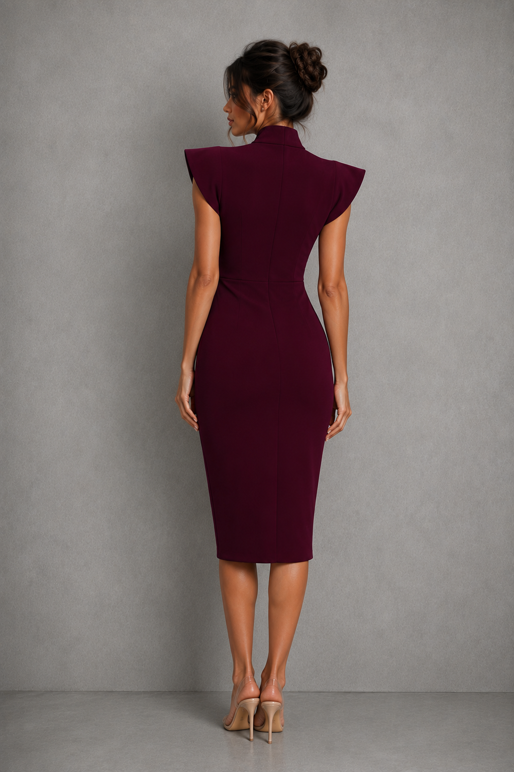 Womenโs midi dress with a stand collar, elegant bow tie neckline, flutter sleeves and flattering slim-fit silhouette.
