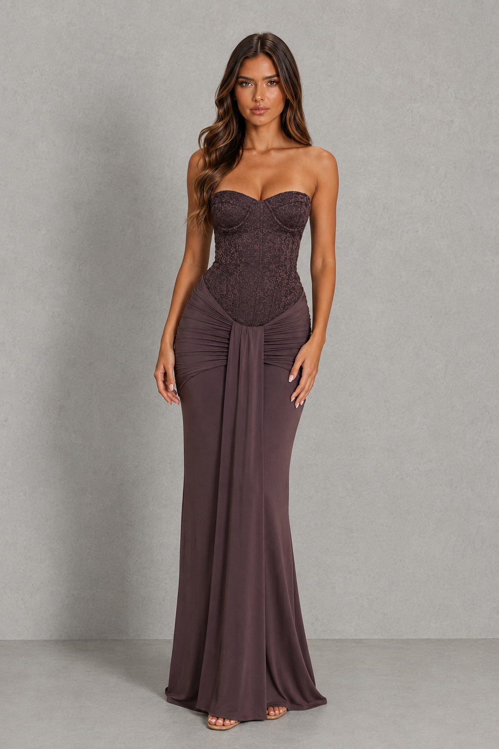 Strapless lace corset maxi dress with structured underwire bodice, ruched hip detailing, and an elegant flowing floor-length skirt.