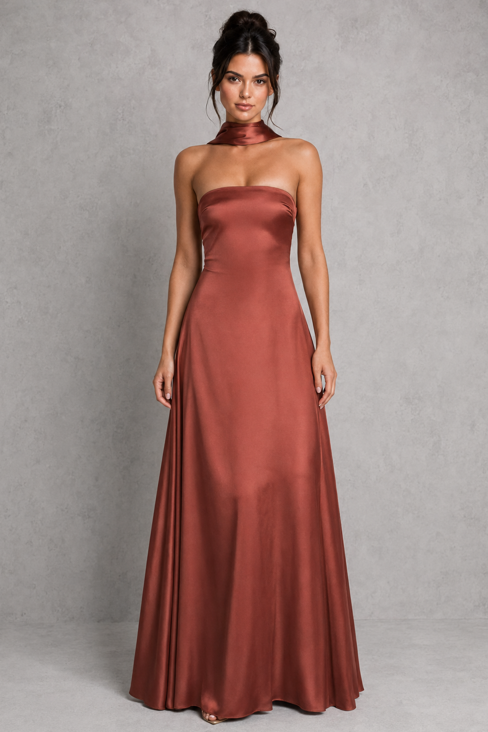 Women's strapless satin maxi dress with a straight neckline, fitted bodice, lace-up back, flowing A-line skirt, and matching satin scarf, ideal for evening events, weddings, and formal occasions.