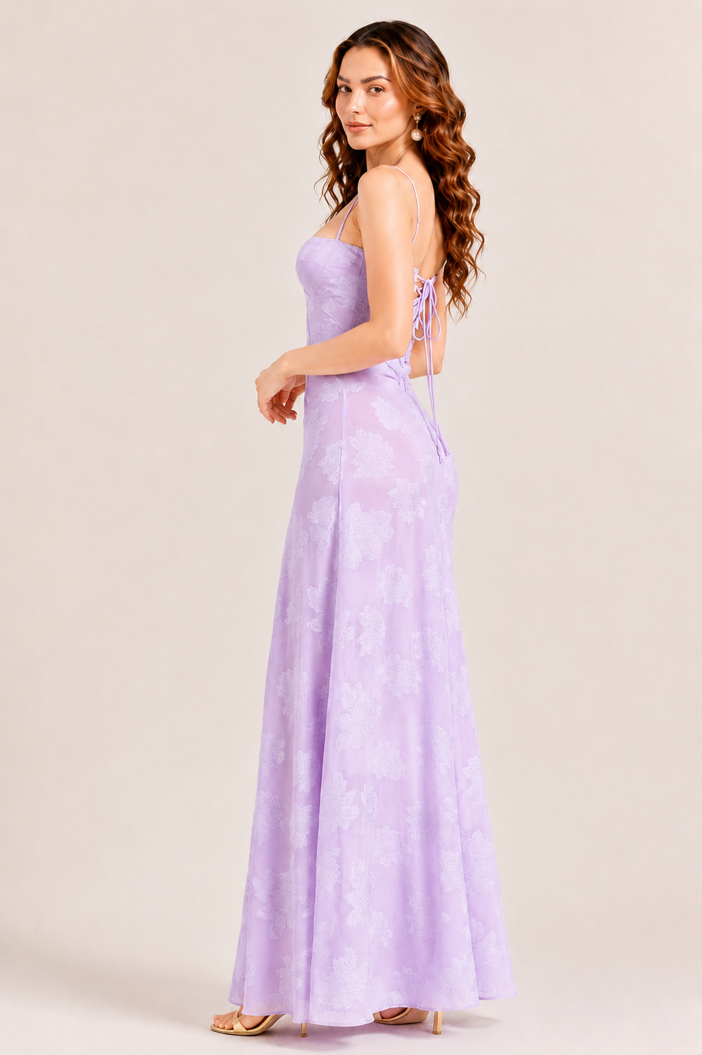 Woman wearing an elegant sweetheart neckline maxi dress with a fitted waist and flowing floor-length skirt, creating a timeless feminine silhouette ideal for weddings, parties, holidays, and special occasions.