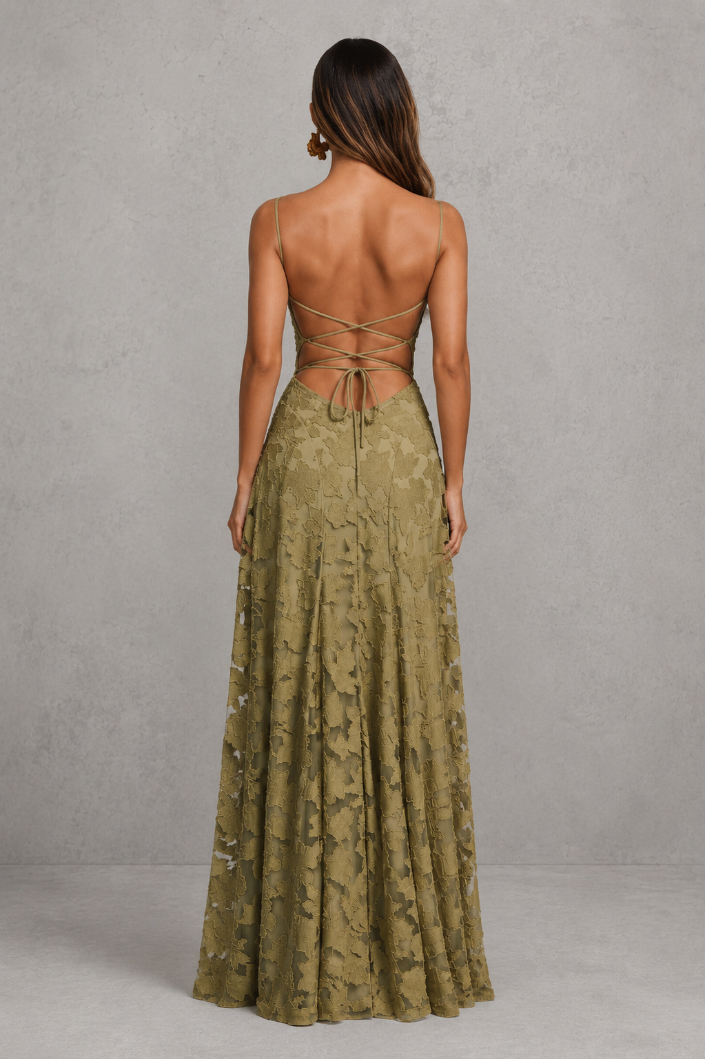 Women’s textured floral maxi dress with delicate shoulder straps, sculpted fitted bodice, defined waist, and flowing full-length skirt.