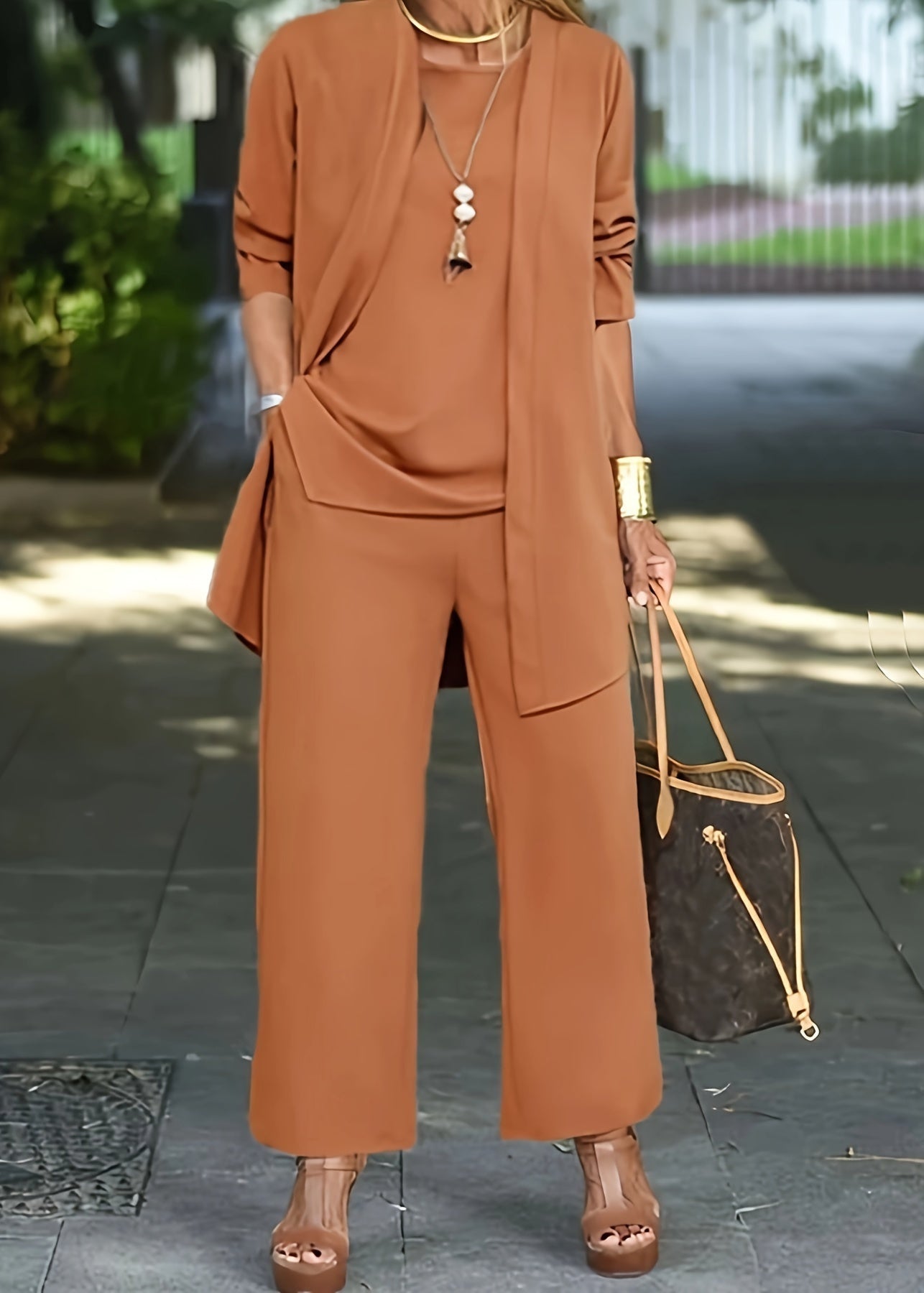 Women’s three-piece outfit set with vest, fitted top, and pants