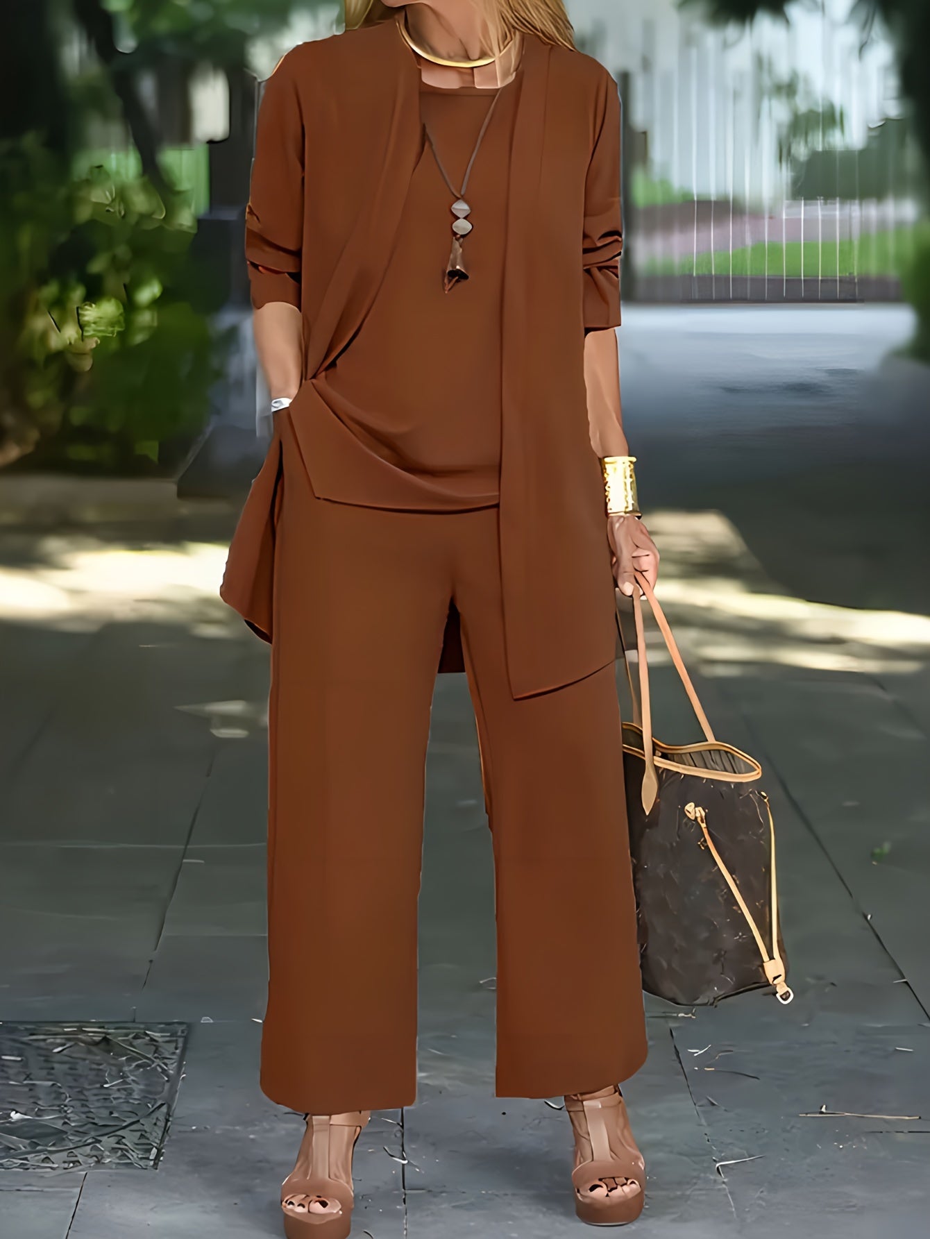 Women’s three-piece outfit set with vest, fitted top, and pants