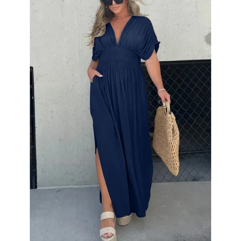 Womenโs V-neck slit maxi dress with flowy silhouette and defined waist for casual and evening wear