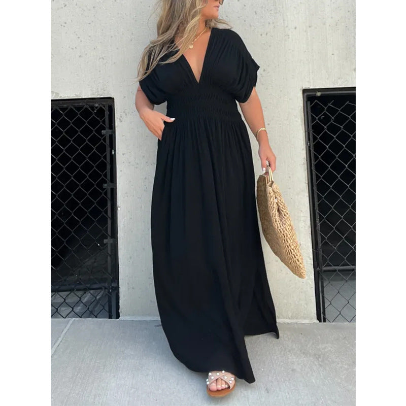 Womenโs V-neck slit maxi dress with flowy silhouette and defined waist for casual and evening wear