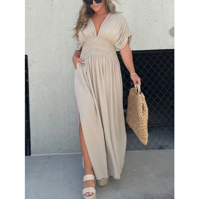 Womenโs V-neck slit maxi dress with flowy silhouette and defined waist for casual and evening wear