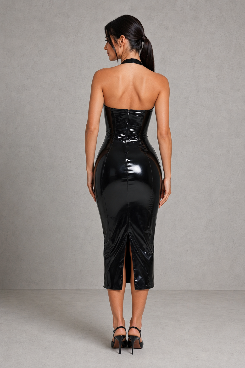 Women's black vinyl midi dress with a plunging halter neckline, body-hugging silhouette, glossy high-shine finish, and fitted design for evening parties and special occasions.