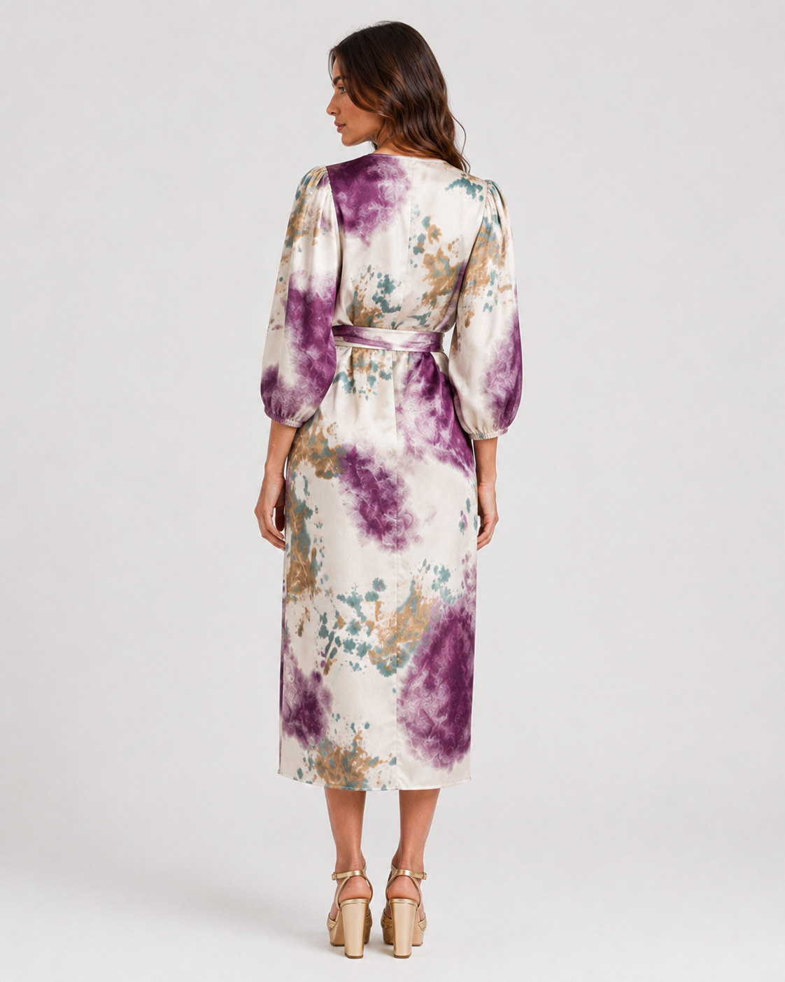 Womenโs printed two-piece set by Klyne Studios featuring a V-neck long sleeve slim-fit top and matching relaxed-fit bottoms in a soft cotton and polyester blend.