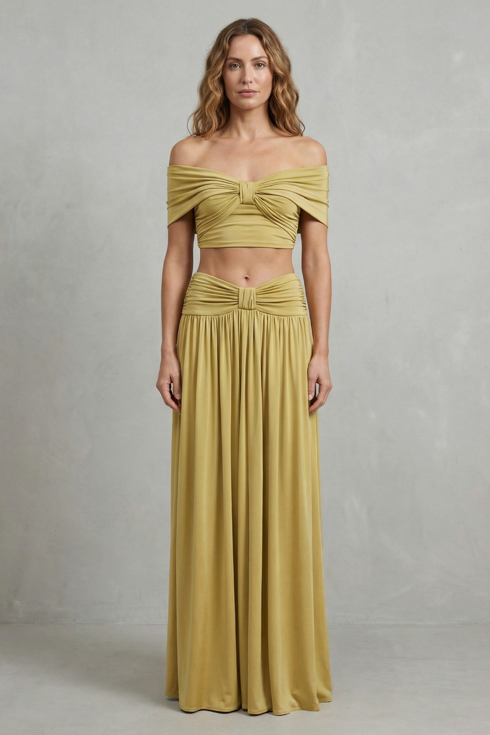 Side view of the golden yellow crop top and floor-length skirt