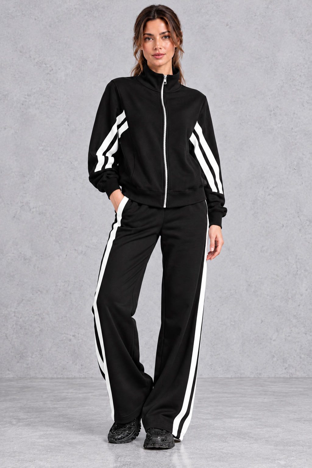Track jacket worn open over a crop top with matching joggers