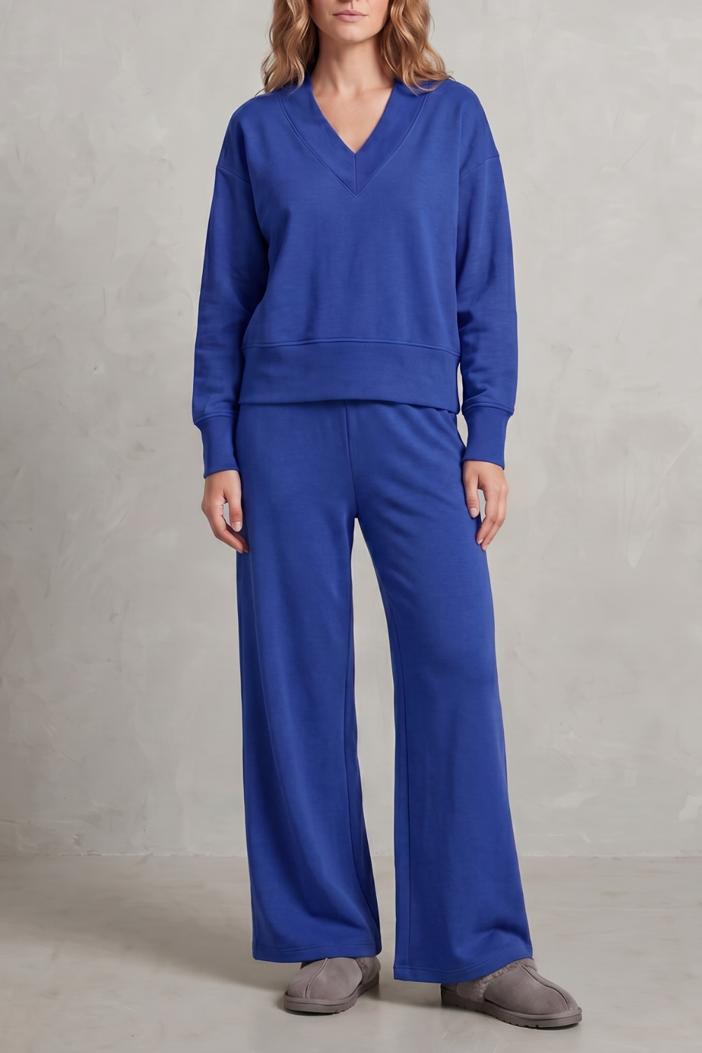 Detail of the V-neckline on the relaxed long-sleeve lounge top