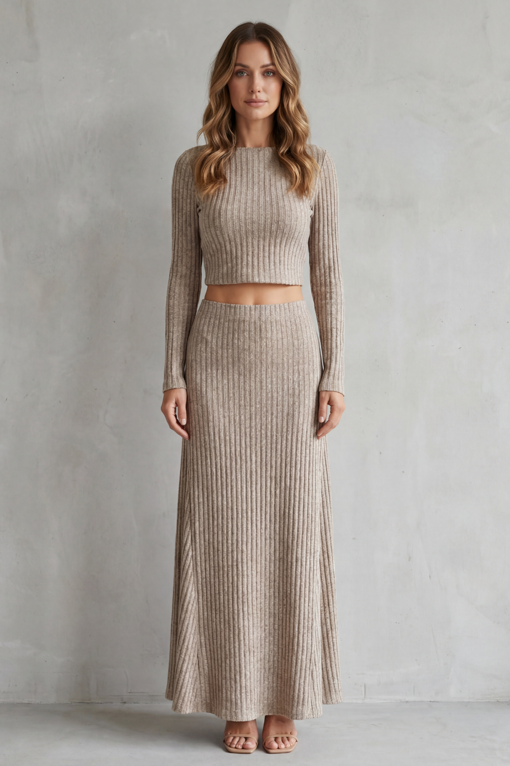 Side view of the ribbed knit top and high-rise A-line skirt