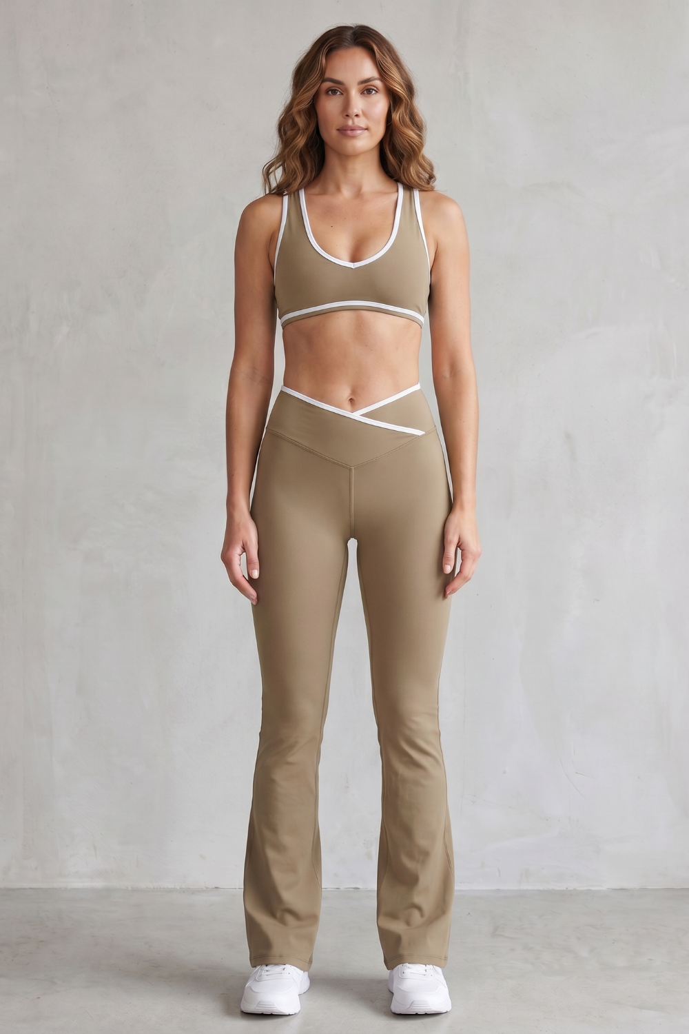Beige colorway of the sports bra and flared leggings set, full-length view