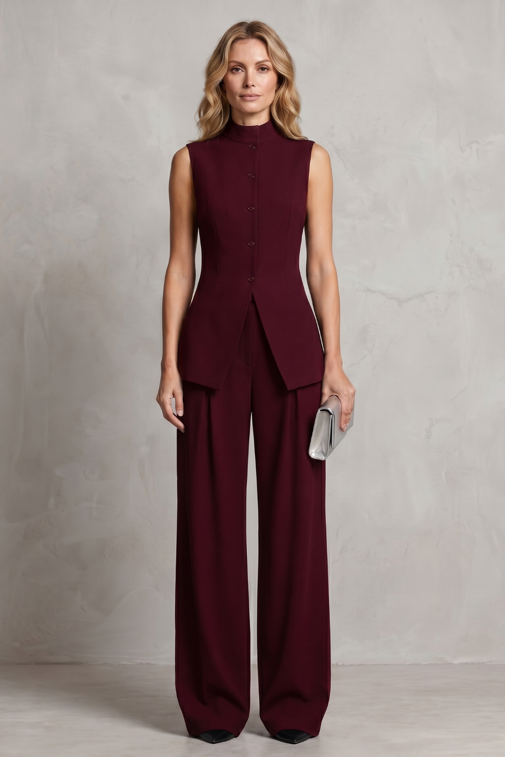 Detail close-up of the tailored waist shaping on the wide-leg pants