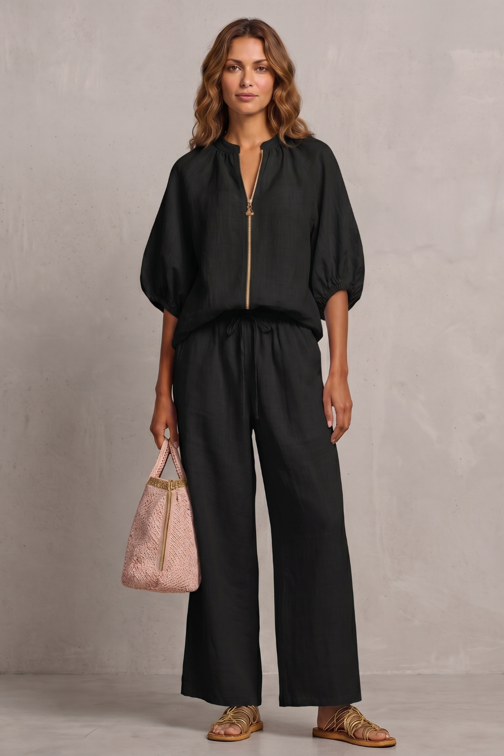 Black colorway of the zip-front top and wide-leg pants set, full-length view