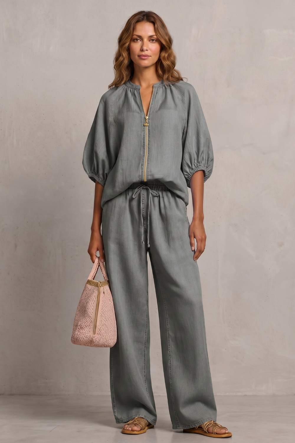 Navy colorway of the zip-front top and wide-leg pants set, full-length view