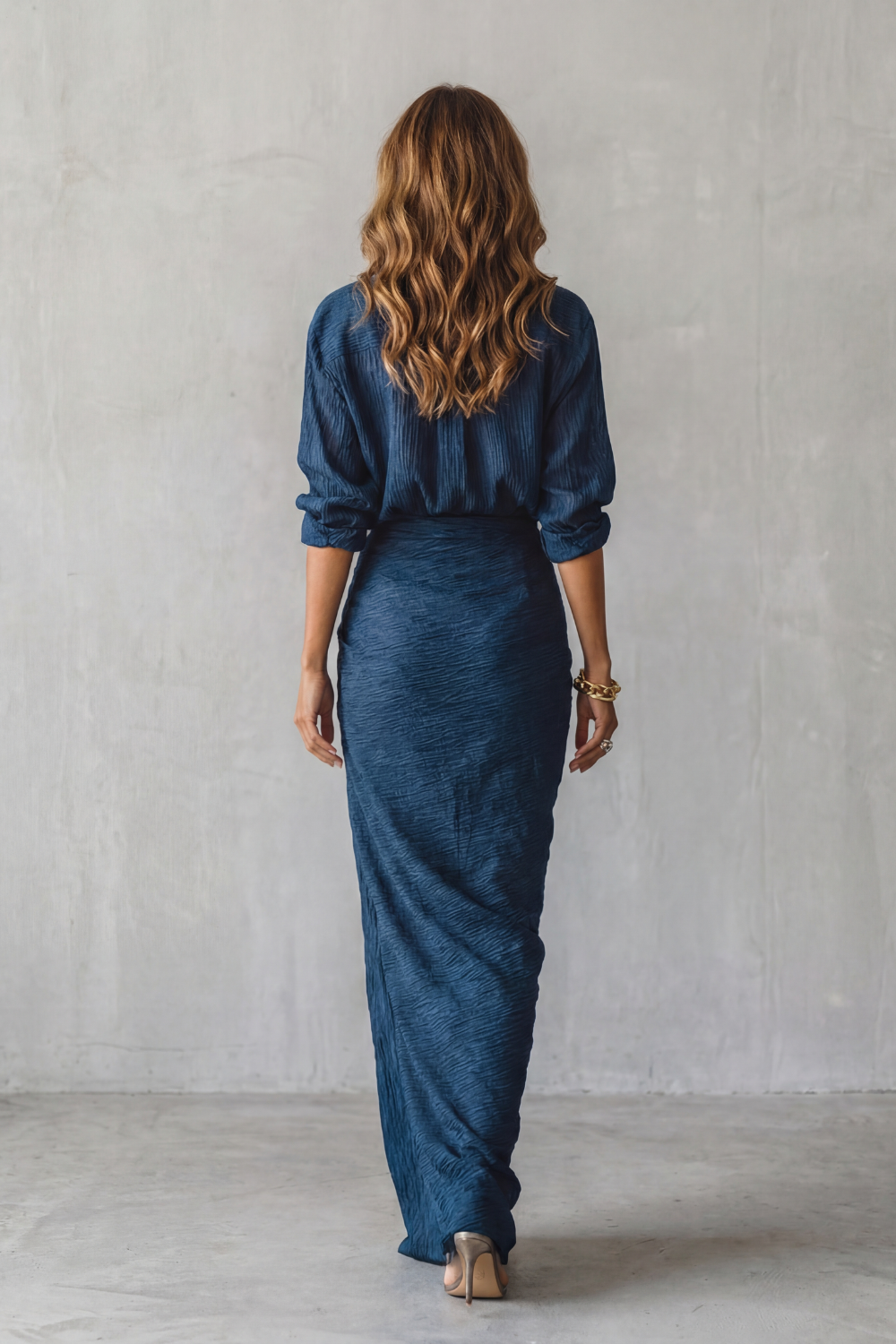 Dark Blue colorway of the pleated blouse and maxi skirt set, full-length view