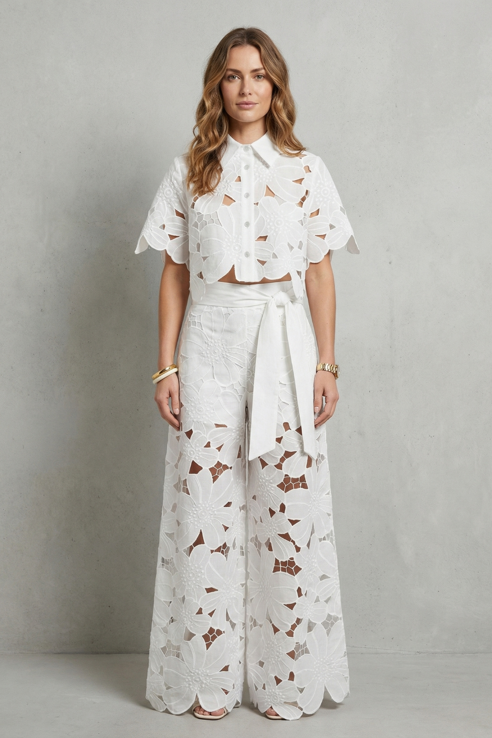 Side view of the short-sleeve lace top and high-waisted flowing skirt
