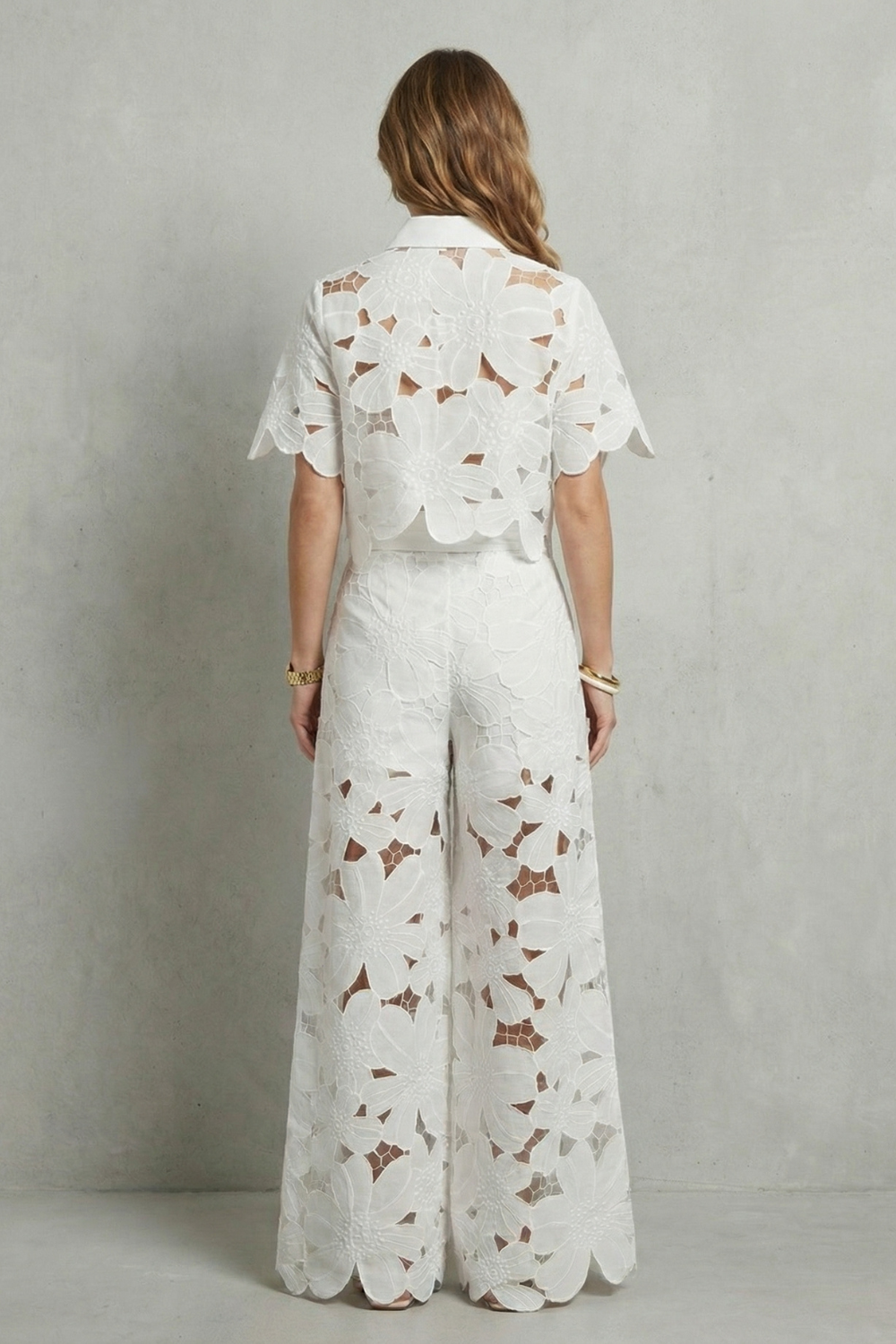 Detail close-up of the floral embroidered cutwork fabric