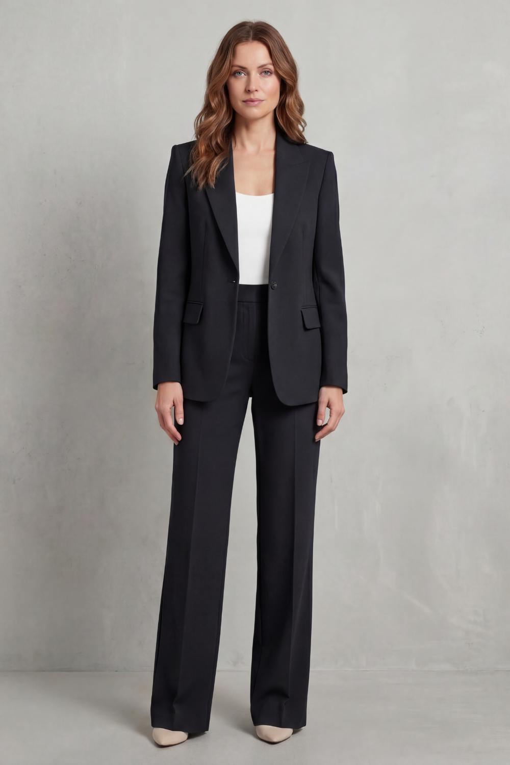 Blazer layered over a tee with sneakers for a street-chic look