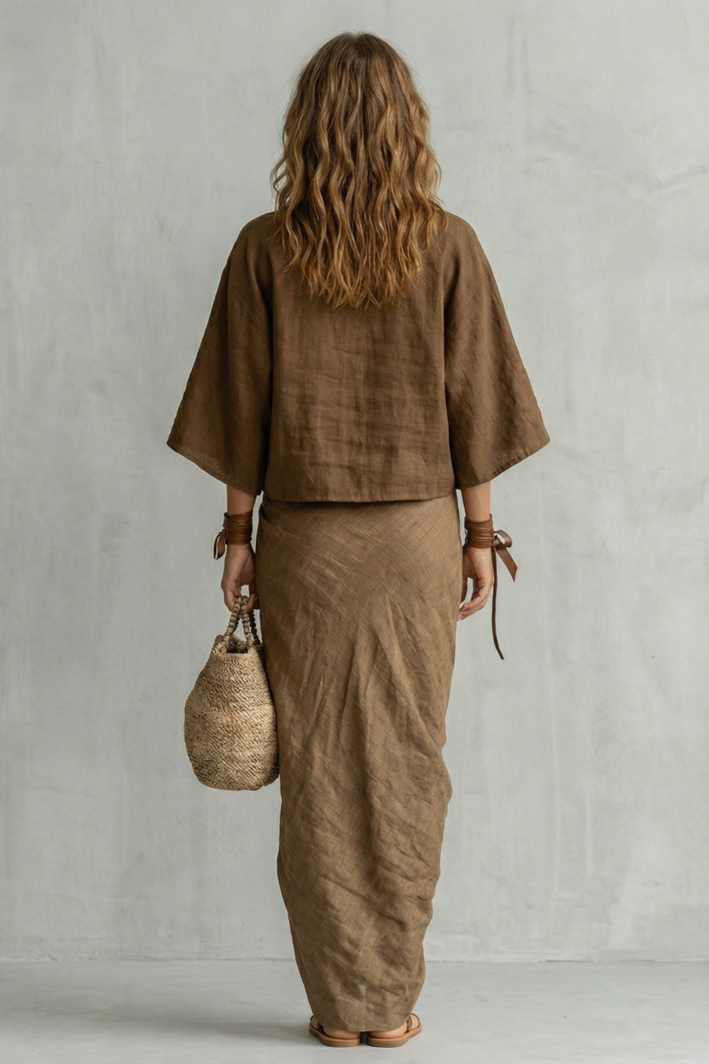 Brown colorway of the batwing top and draped maxi skirt set, full-length view