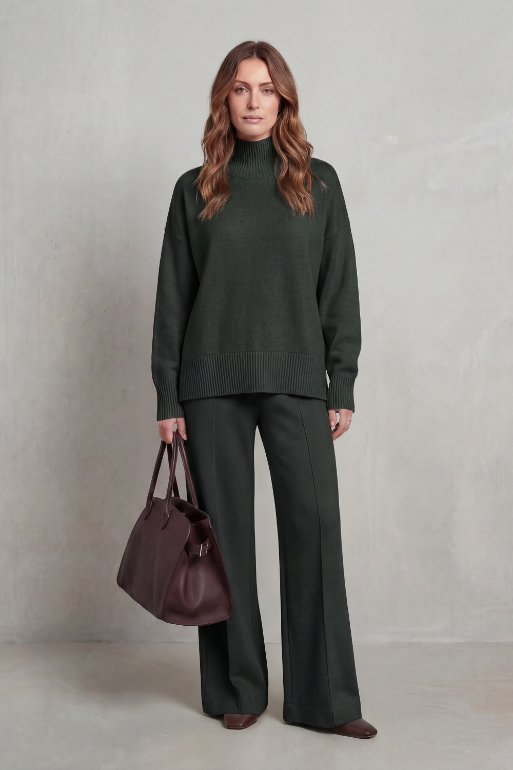 Knit lounge set styled with an oversized coat and leather tote