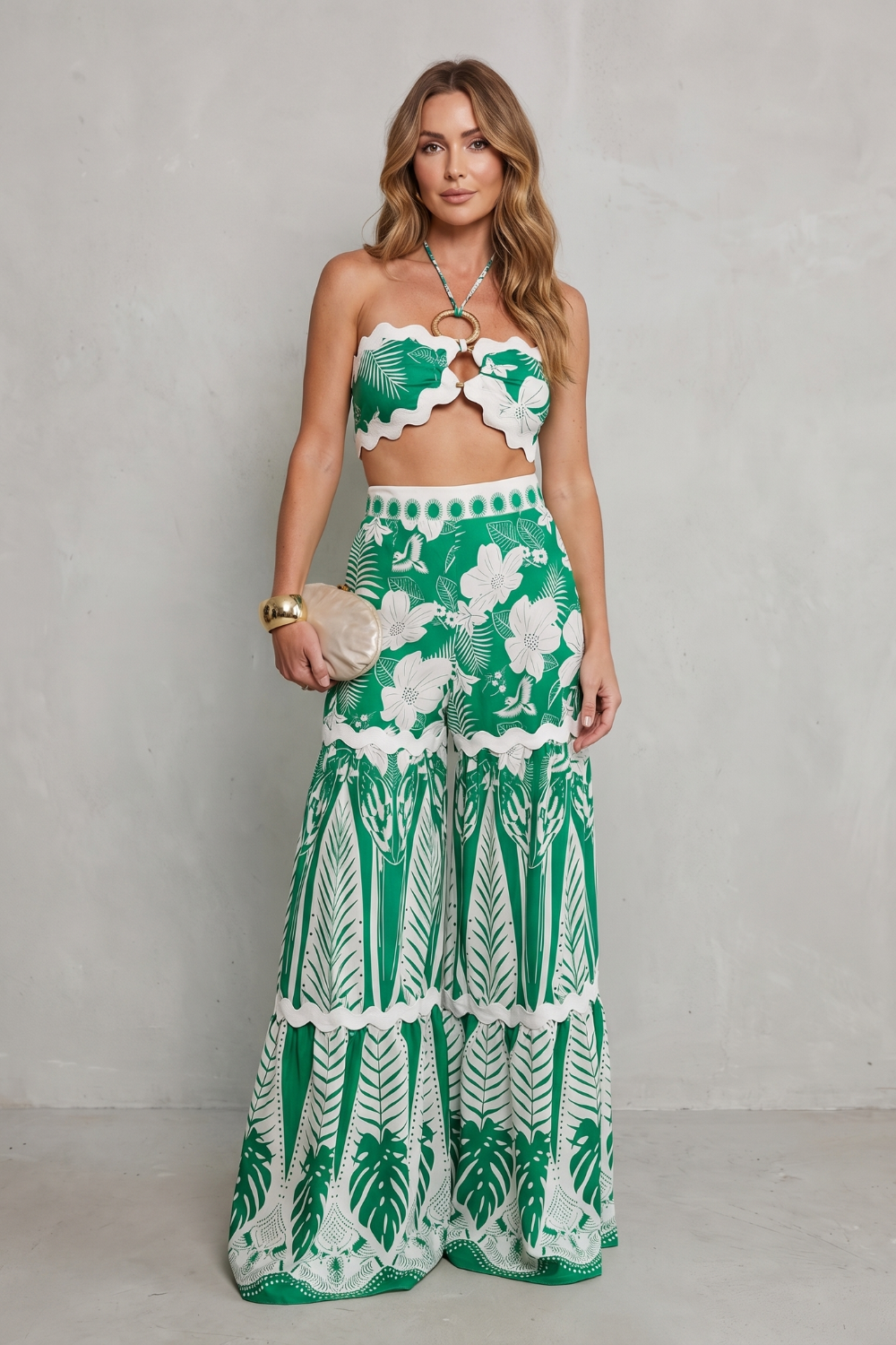 Side view of the tropical print halter crop top and wide-leg pants