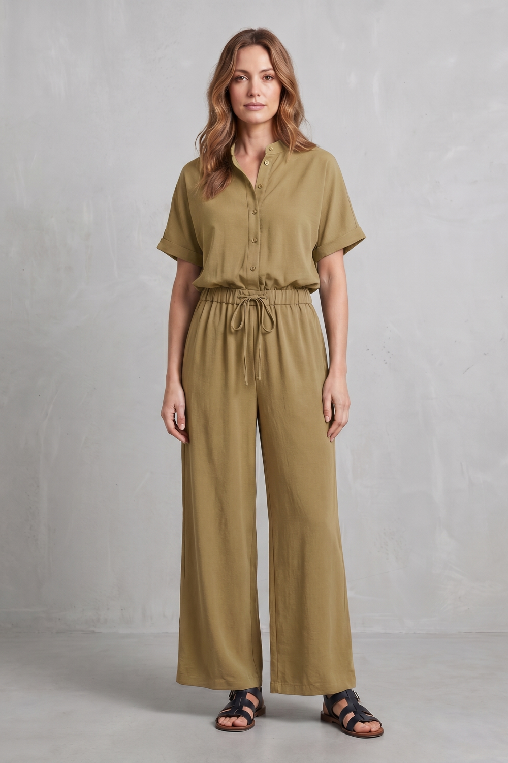 Blue colorway of the short-sleeve top and pants set, full-length view